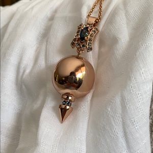 Rose gold necklace with blue stone pendant